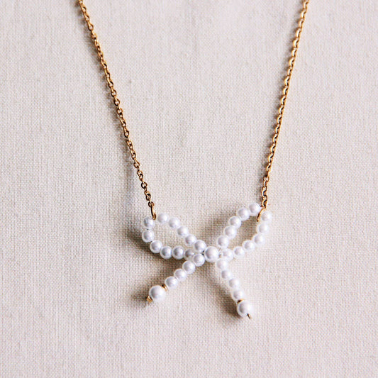 Stainless steel fine chain with pearl bow - gold